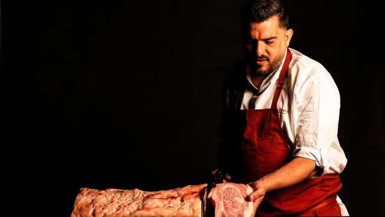 Dany Karam of Magma carving dry aged wagyu