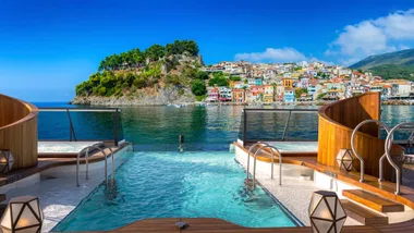 The view of oceans and cities from poolside aboard an APT Luxury Travel cruise ship