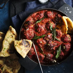 Braised pork and cavolo nero meatballs with roast garlic butter pizza fritti
