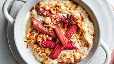 Creamy coconut rice pudding topped with tender rhubarb and star anise
