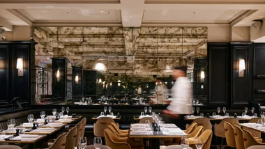 Mirrored walls, high ceilings and luxurious seats at GT's best new restaurant of the year, Maison Bâtard in Melbourne.