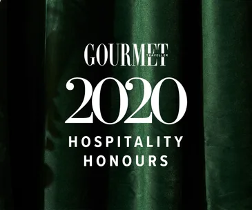 A emerald-green velvet background, with white text overlaid that reads Gourmet Traveller 2020 Hospitality Honours