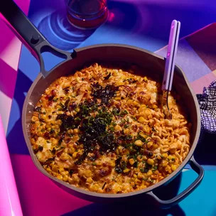 Skillet buldak noodles with charred corn and cheese,