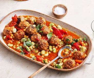 Ceramic platter with meatballs, tomato sauce and beans